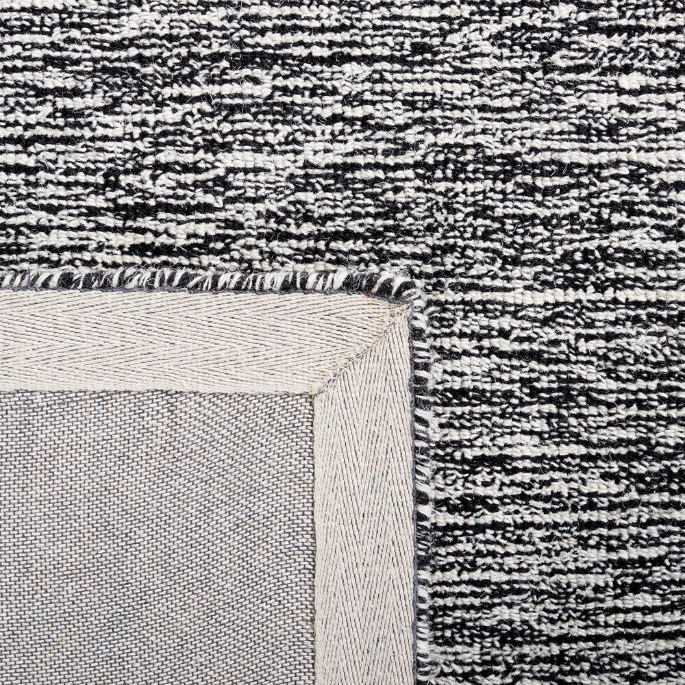 SAFAVIEH Abstract Wool Area Rug 5x8, Bordered Black & Ivory ABT478Z