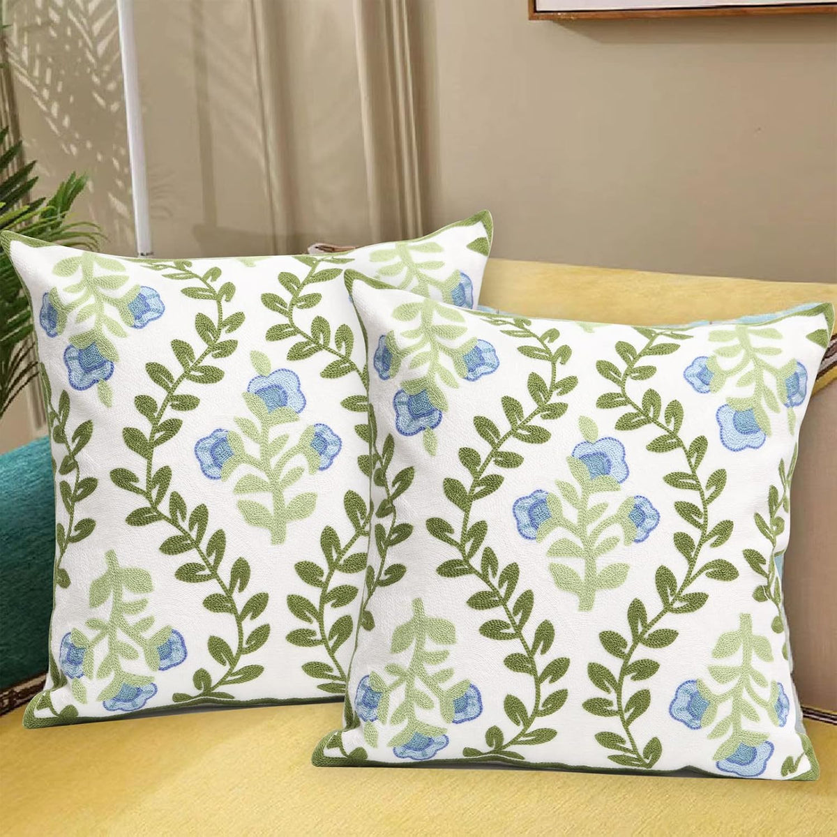 set of 2 embroidered decorative throw pillow covers shown in use