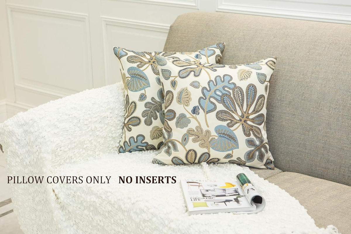 set of 2 jacquard tropical leaf pattern throw shown in use